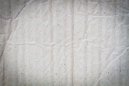 background of crumpled grey cardboard with texture, vignetteの写真素材