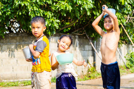 CHIANG RAI, THAILAND - APRIL 13 : Songkran festival, unidentified children enjoy splashing water together on April 13, 2015 in Chiang rai, Thailand.のeditorial素材