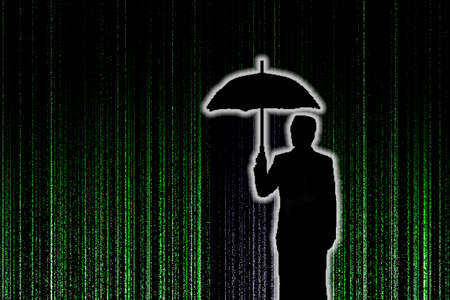 Silhouette of businessman who is appeared with umbralla through the green matrix rain background, security conceptの写真素材
