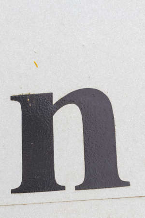 Closeup black letter n from traffic road sign in thailandの写真素材