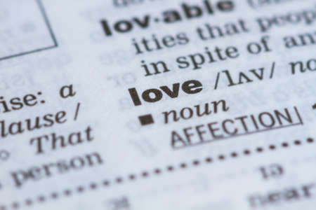 closeup word love  in dictionary, soft focus,の写真素材