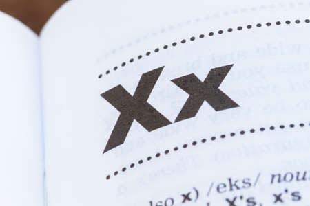 closeup letter X in dictionary, soft focus,の写真素材