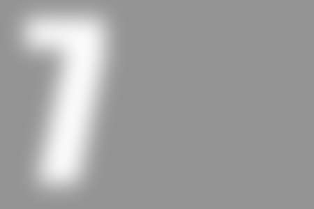 gray abstract background with defocused white international number 7 on the left, copyspace on the rightの写真素材