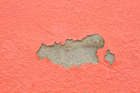 old paint and wall, cracked wall color orangeの写真素材
