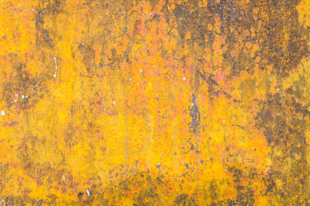 grunge yellow background with some spots and stains on itの写真素材