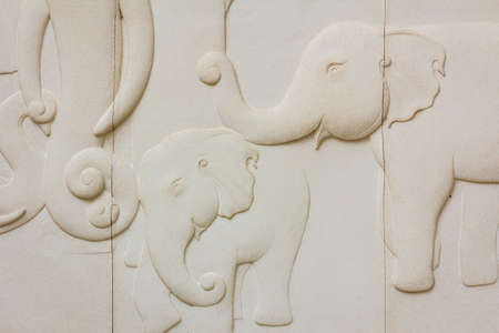 elephant texture pattern on stone wall in public thai templeの写真素材