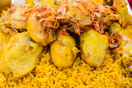 close up Chicken Biryani with green chutney in thai market.
