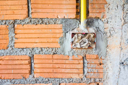 Wire box with brown paper before plastering cement mortar in the wall.の写真素材
