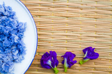 Blue sticky Rice made from Butterfly Pea flower(Asian pigeonwings) on traditional mat. Good for health. copyspaceの写真素材