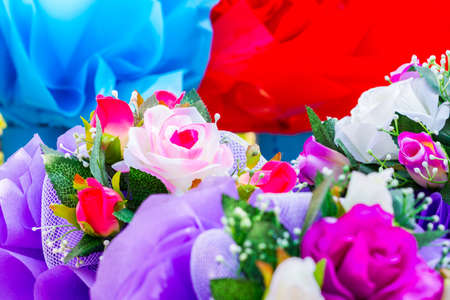 closeup bouquet of colorful artificial flowerの写真素材