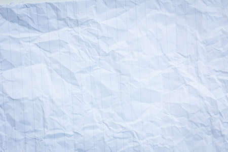 extreme closeup of crumpled paper with vertical lines.の写真素材