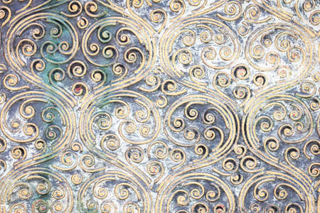 grunge golden spiral texture on the wall.の写真素材