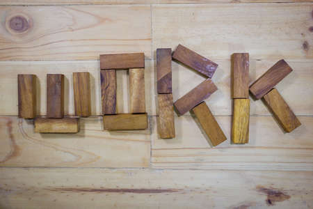 Word WORK made of wood stick on wooden backgroundの写真素材