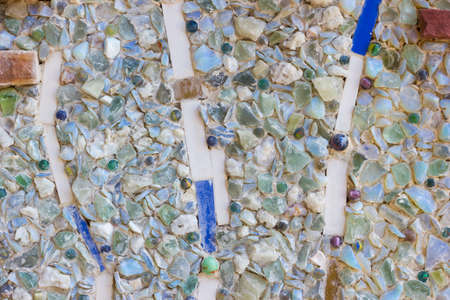 Colorful mosaic abstract background made of broken glass and ceramic pots.の写真素材