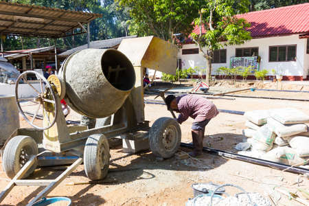 LAMPANG, THAILAND - NOVEMBER 5 : unidentified thai teenagers in working camp preparing the area for pouring concrete to make plaza on November 5, 2016 in Lampang, Thailand.のeditorial素材