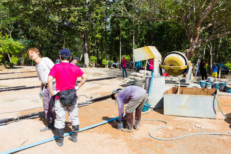 LAMPANG, THAILAND - NOVEMBER 5 : unidentified thai teenagers in working camp preparing the area for pouring concrete to make plaza on November 5, 2016 in Lampang, Thailand.のeditorial素材