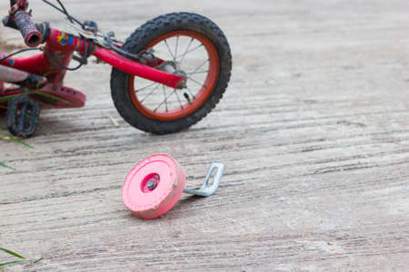 horizontal photo of closeup bicycle for children accident on the city street.の写真素材