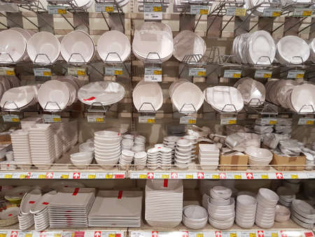 CHIANG RAI, THAILAND - NOVEMBER 29 : various brand of white plastic dishes in packaging for sale on supermarket stand or shelf on November 29, 2016 in Chiang rai, Thailand.のeditorial素材