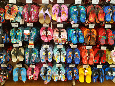 CHIANG RAI, THAILAND - FEBRUARY 6: various brand of toe post sandals for sale on supermarket stand or shelf on February 6, 2017 in Chiang rai, Thailand.のeditorial素材