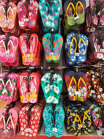 CHIANG RAI, THAILAND - FEBRUARY 6: various brand of toe post sandals for sale on supermarket stand or shelf on February 6, 2017 in Chiang rai, Thailand.のeditorial素材