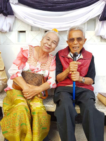 CHIANG RAI, THAILAND - FEBRUARY 5 : unidentified smiling old asian couple sit together on February 5, 2017 in Chiang rai, Thailand.のeditorial素材