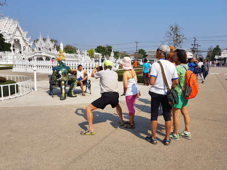 CHIANG RAI, THAILAND - MARCH 1 : Unidentified tourists taking photo or selfie Wat Rong Khun temple on March 1, 2017 in Chiang rai, Thailandのeditorial素材