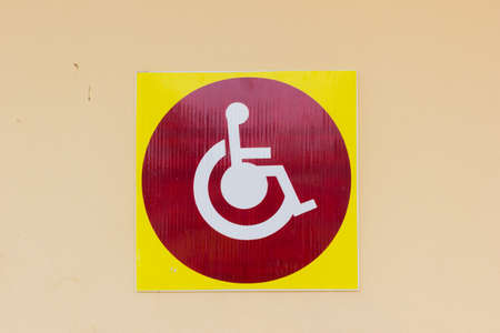 handicapped sign detail of an information signal disabled on the wallの写真素材