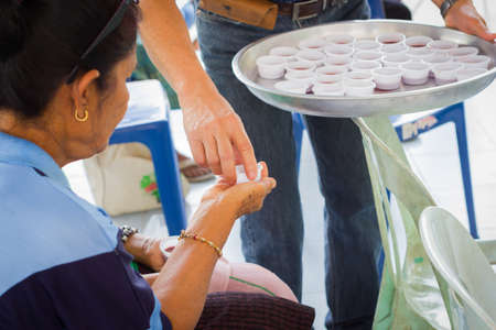 CHIANG RAI, THAILAND - FEBRUARY 20 : unidentified people join Holy Communion, taking wine on February 20, 2016 in Chiang rai, Thailand.のeditorial素材