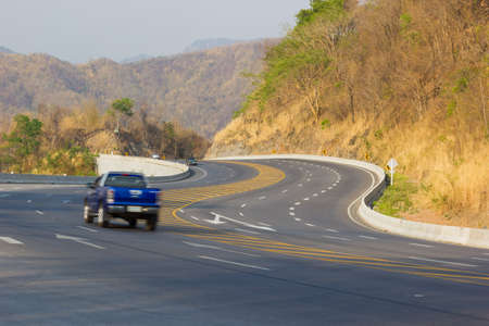 CHIANG RAI, THAILAND - FEBRUARY 20 : Curve asphalt highway in the mountain with vehicles, Thailand on February 20, 2016 in Chiang rai, Thailand.のeditorial素材