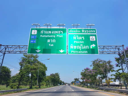 KAMPHAENG PHET, THAILAND - MARCH 31 : directional traffic sign to Phitsanuloke on March 31, 2017 in Kamphaeng Phet, Thailand.のeditorial素材