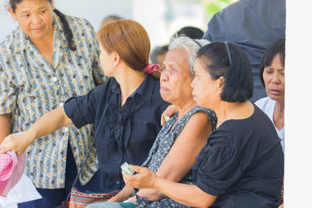 CHIANG RAI, THAILAND - APRIL 19 : unidentified asian old woman crying in thai traditional Christian funeral on April 19, 2017 in Chiang rai, Thailand.のeditorial素材