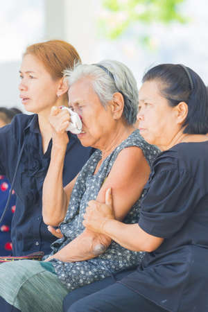 CHIANG RAI, THAILAND - APRIL 19 : unidentified asian old woman crying in thai traditional Christian funeral on April 19, 2017 in Chiang rai, Thailand.のeditorial素材
