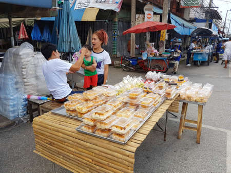 KAMPHAENG PHET, THAILAND - MAY 6 : unidentified asian people selling bakery products in Nakhon Chum street market on May 6, 2017 in Kamphaeng Phet, Thailand.のeditorial素材