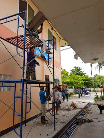 CHIANG RAI, THAILAND - MARCH 29 : unidentified workers repairing or changing roof of Thai protestant church on March 29, 2017 in Chiang rai, Thailand.のeditorial素材
