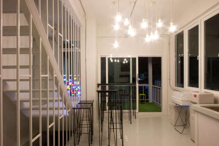 white modern kitchen with lights at night