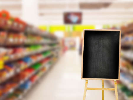 empty or blank menu black board on the right on blurred colorful supermarket interiorの写真素材