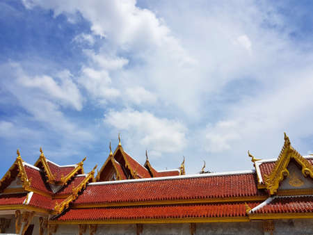 Roof of thai temple in Bangkok in the cloudy skyのeditorial素材