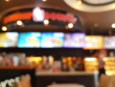 blur coffee shop used for background with bokeh from the light bulbのeditorial素材