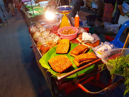 CHIANG MAI, THAILAND - SEPTEMBER 29 : pork and food sold at street market in the evening on September 29, 2017 in Chiang Mai, Thailand.のeditorial素材