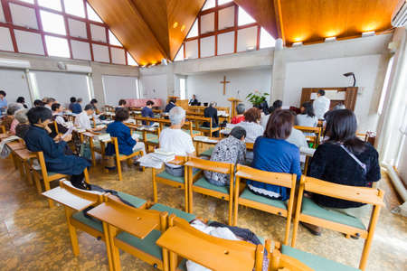 OSAKA, JAPAN - SEPTEMBER 17 : unidentified asian Christians praying in church  on September 17, 2017...