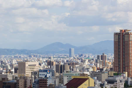 OSAKA, JAPAN - SEPTEMBER 18 : aerial view Osaka commercial and business cityscape at afternoon from top level of Osaka castle on September 18, 2017 in Osaka, Japan.のeditorial素材