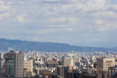 OSAKA, JAPAN - SEPTEMBER 18 : aerial view Osaka commercial and business cityscape at afternoon from top level of Osaka castle on September 18, 2017 in Osaka, Japan.のeditorial素材