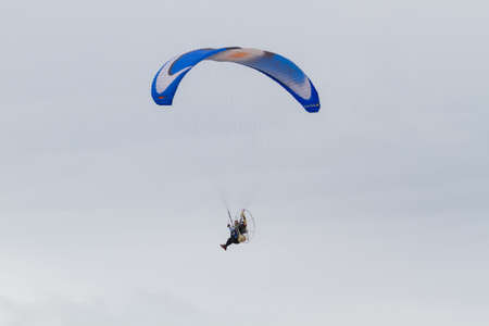 CHIANGRAI, THAILAND - DECEMBER 29: unidentified pilot flying in sky with paramotor engine glider parachute on December 29, 2017 in Chiangrai, Thailand.のeditorial素材