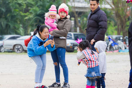 CHIANG RAI, THAILAND - JANUARY 13 : Unidentified mather taking photos her daughter on January 13, 2018 in Chiang rai, Thailand.のeditorial素材