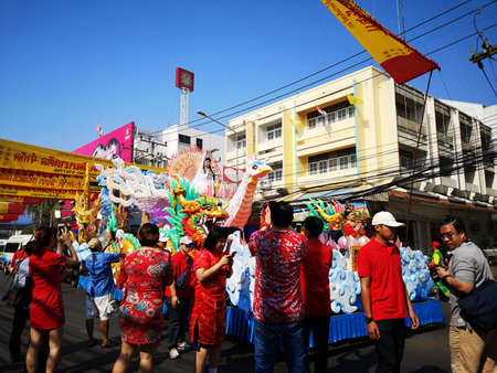 NAKHON SAWAN, THAILAND - FEBRUARY 8 : unidentified asian people watching dragon parade in Chinese...