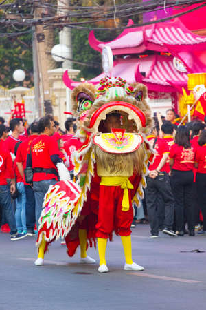 NAKHON SAWAN, THAILAND - FEBRUARY 8 : unidentified asian man in dancing lion in Chinese New Year...