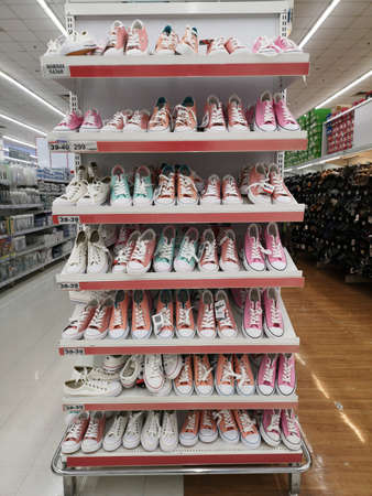CHIANG RAI, THAILAND - FEBRUARY 12 : many pair of sneakers on shelves sold in supermarket  on February 12, 2019 in Chiang rai, Thailand.のeditorial素材