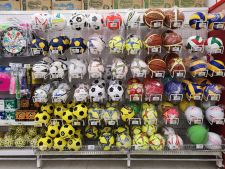 CHIANG RAI, THAILAND - NOVEMBER 20 : balls or sport equipment sold on supermarket stand or shelf on November 20, 2019 in Chiang Rai, Thailand.のeditorial素材