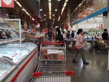 CHIANG RAI, THAILAND - FEBRUARY 29 : unidentified asian customers with hygienic mask walking around supermarket during spread of coronavirus or Covid-19 on February 29, 2020 in Chiang Rai, Thailand.のeditorial素材