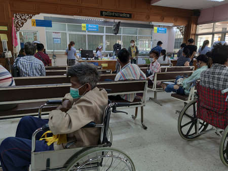 CHIANG RAI, THAILAND - MARCH 23 : Unidentified asian people try not to sit close to each other in Phan hospital during the spread of Covid-19 virus on March 23, 2020 in Chiang Rai, Thailand.のeditorial素材